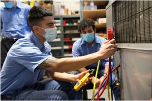 Students operating technical machinery