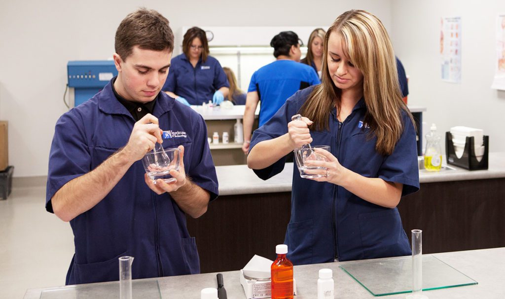 Students mixing things in glass bowls