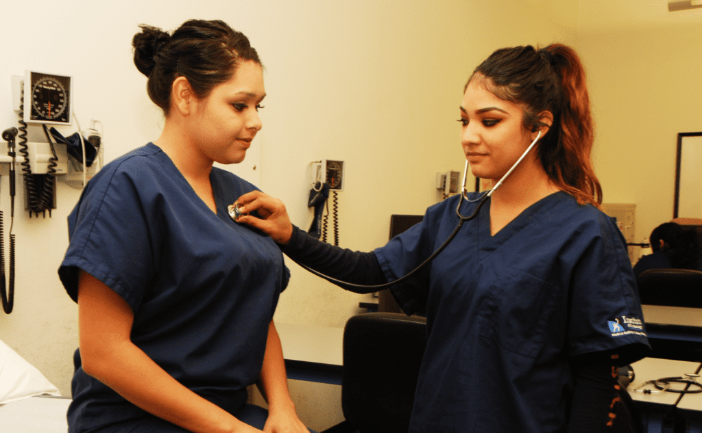 Woman listening through stethoscope