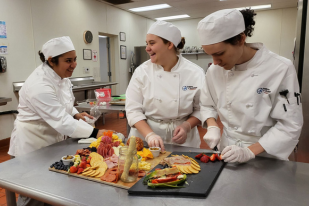 Students in the Institute of Technology Culinary Arts program gaining hands-on experience in a commercial kitchen.